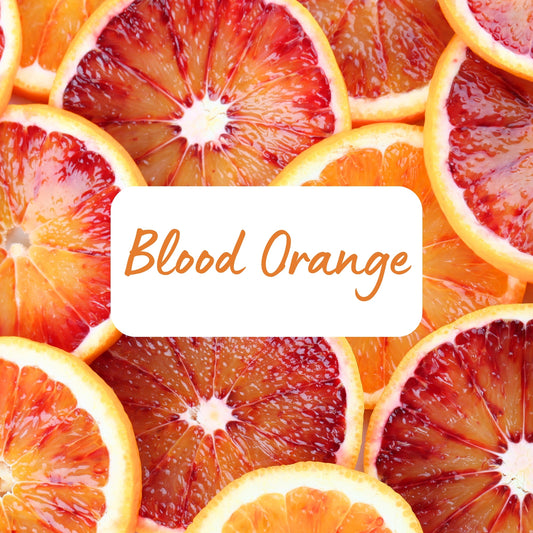 Close-up of sliced blood oranges with a 'Blood Orange' label.