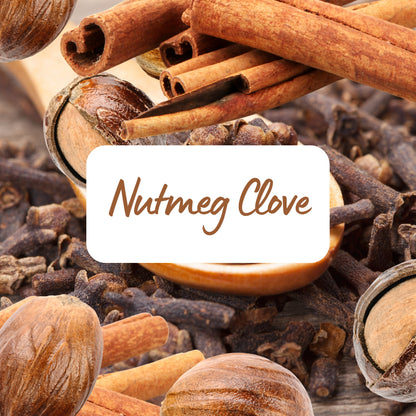 Spices including nutmeg, cloves, and cinnamon with a label in the center.