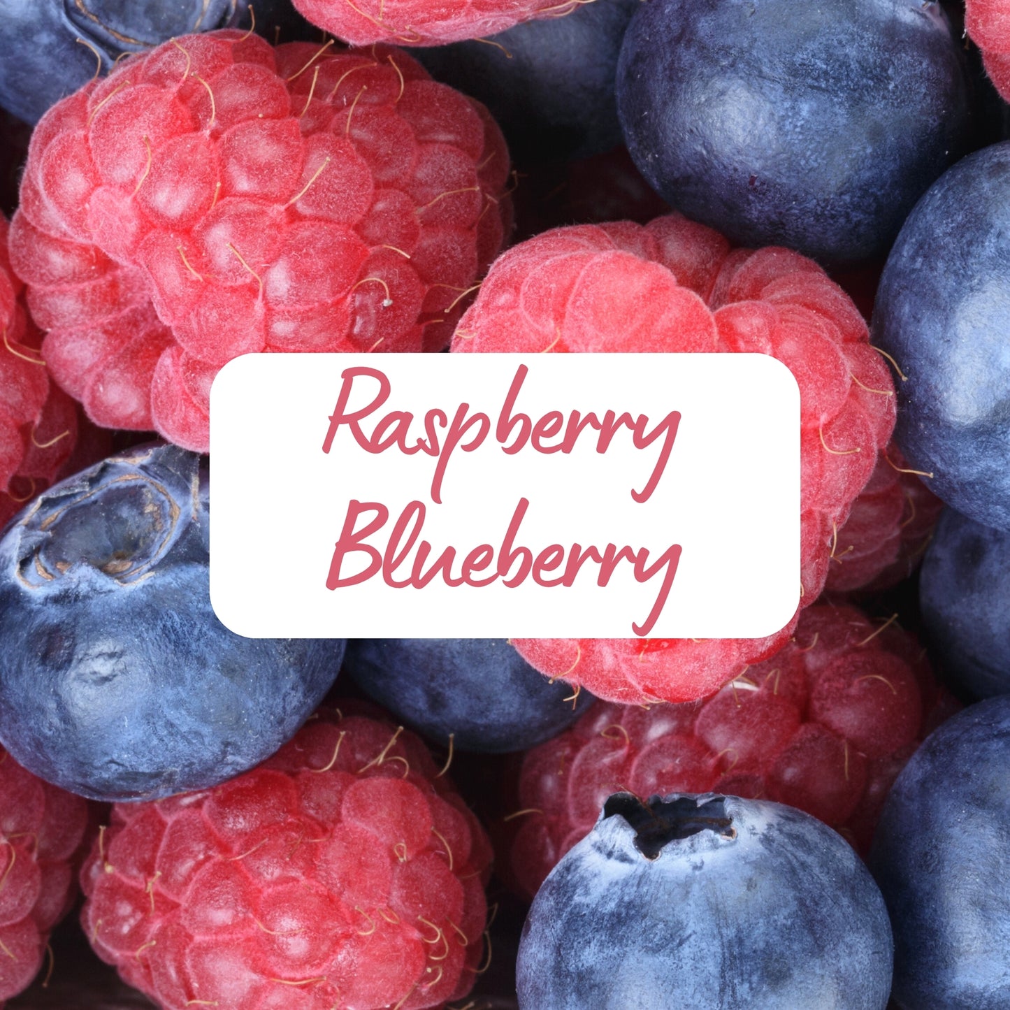 Close-up of raspberries and blueberries with a label in the center.
